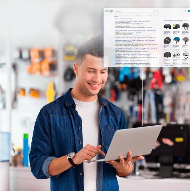 Butiksejer med laptop og Google Shopping-resultater